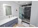 Modern bathroom with a marble tiled wall, black marble shower and updated vanity sink at 777 N Ashley Dr # 2313, Tampa, FL 33602