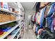Organized walk-in closet with shelves, hanging racks, and a full-length mirror at 777 N Ashley Dr # 2313, Tampa, FL 33602
