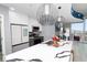 Kitchen with stainless appliances, waterfall countertop island with sink, seating and pendant lighting at 777 N Ashley Dr # 2313, Tampa, FL 33602