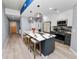 Modern kitchen features a large island, stainless appliances, and stylish pendant lighting at 777 N Ashley Dr # 2313, Tampa, FL 33602