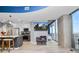 Open kitchen and living space with modern fixtures, island seating, and balcony access at 777 N Ashley Dr # 2313, Tampa, FL 33602