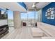 Bright living room with city views, a large comfortable couch and access to the outdoor balcony at 777 N Ashley Dr # 2313, Tampa, FL 33602
