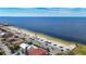 Breathtaking aerial view of a beach, showcasing its pristine shoreline and calm, blue waters at 5509 Pilots Pl, New Port Richey, FL 34652