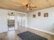 The bedroom is a retreat with custom closet, wood flooring and ample natural light at 5509 Pilots Pl, New Port Richey, FL 34652