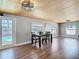 The dining room features a wood ceiling, wood floors, and views of the canal at 5509 Pilots Pl, New Port Richey, FL 34652