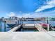 Dock with a boat lift and kayak, offering direct access to the serene waterfront and boating adventures at 5509 Pilots Pl, New Port Richey, FL 34652