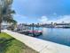 Waterfront dock featuring boat lifts and a kayak, providing convenient access to boating and water activities at 5509 Pilots Pl, New Port Richey, FL 34652