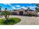 Charming single-story home with a paver driveway and tropical landscaping for curb appeal at 5509 Pilots Pl, New Port Richey, FL 34652