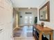 Welcoming foyer with tiled floor, console table, and stylish decor at 5509 Pilots Pl, New Port Richey, FL 34652