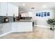 Bright kitchen features a white cabinetry, granite countertops, and tile backsplash at 5509 Pilots Pl, New Port Richey, FL 34652