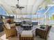 Stylish lanai overlooking the water, featuring comfortable seating and a decorative stone feature at 5509 Pilots Pl, New Port Richey, FL 34652