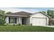 Charming single-story home featuring a two-car garage, shutters, and landscaped front yard at 6030 Mangrove Creek Rd, Wimauma, FL 33598