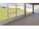 Covered lanai with screen windows overlooking spacious backyard at 6058 Barracuda Loop, Wimauma, FL 33598
