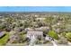 Aerial view of the home with a white fence and long driveway surrounded by trees at 11175 Hyde St, Weeki Wachee, FL 34614