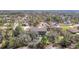 Aerial view showing the home nestled in lush greenery with surrounding neighborhood at 11175 Hyde St, Weeki Wachee, FL 34614