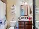 Bathroom with a vanity, mirror, and a shower-tub combination at 11175 Hyde St, Weeki Wachee, FL 34614