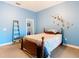 Bedroom features a striking blue color, ceiling fan, and potential for customization at 11175 Hyde St, Weeki Wachee, FL 34614