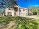 Beautiful two-story home featuring a three car garage and traditional architecture surrounded by lush landscaping at 11175 Hyde St, Weeki Wachee, FL 34614