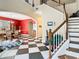 Spacious foyer with decorative ceilings, open archways and black and white checkerboard tile at 11175 Hyde St, Weeki Wachee, FL 34614