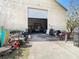A large, open garage filled with tools and vehicles is perfect for projects and storage at 11175 Hyde St, Weeki Wachee, FL 34614
