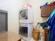 Laundry room with stacked washer and dryer at 11175 Hyde St, Weeki Wachee, FL 34614