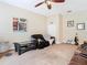 Another view of the living room, with beige walls and ample space at 11175 Hyde St, Weeki Wachee, FL 34614