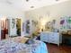 Cozy main bedroom featuring an ensuite bath, closet and queen-sized bed at 11175 Hyde St, Weeki Wachee, FL 34614
