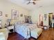 Charming main bedroom with a queen-sized bed and ensuite bathroom access at 11175 Hyde St, Weeki Wachee, FL 34614