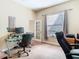 Spacious office features a glass-top desk, comfortable seating, and ample natural light at 11175 Hyde St, Weeki Wachee, FL 34614