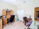 Well-equipped office with built-in desk, filing cabinets, and dual seating areas for productivity at 11175 Hyde St, Weeki Wachee, FL 34614