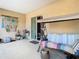 A shaded patio is adorned with coastal decor, a charming swing, and convenient access to the indoors at 11175 Hyde St, Weeki Wachee, FL 34614
