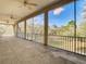 A large, covered porch with screened openings that let in natural light and breeze at 11175 Hyde St, Weeki Wachee, FL 34614