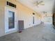 Large covered porch featuring doors offering seamless indoor-outdoor living at 11175 Hyde St, Weeki Wachee, FL 34614