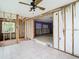 A partially renovated living room shows the open layout, tile floors, and ceiling fan at 4745 Floramar Ter, New Port Richey, FL 34652