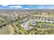 Aerial view of a residential neighborhood featuring manicured lawns, community lakes and beautiful homes at 7048 White Willow Ct, Sarasota, FL 34243