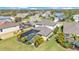 Aerial view showcasing the house, pool, and well-manicured yard in a desirable neighborhood at 7048 White Willow Ct, Sarasota, FL 34243