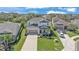 Beautiful aerial view of a two-story home with a well-maintained yard and a spacious driveway at 7048 White Willow Ct, Sarasota, FL 34243