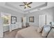 Spacious bedroom with a tray ceiling, carpet flooring, and a dresser at 7048 White Willow Ct, Sarasota, FL 34243