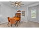 Dining room with hard flooring, a ceiling fan, and natural light at 7048 White Willow Ct, Sarasota, FL 34243