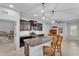 Modern kitchen with stainless steel appliances, granite countertops, and a functional center island at 7048 White Willow Ct, Sarasota, FL 34243