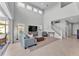Bright living room featuring soaring ceilings, neutral tones, and an open floor plan at 7048 White Willow Ct, Sarasota, FL 34243