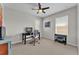 Spacious home office with a comfortable chair, a computer, a printer, and two windows at 7048 White Willow Ct, Sarasota, FL 34243