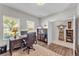 Cozy home office featuring a wood desk and comfortable executive chair at 7048 White Willow Ct, Sarasota, FL 34243