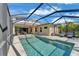 A refreshing pool and lanai provide space to enjoy outdoor Florida living at 7048 White Willow Ct, Sarasota, FL 34243
