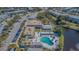 Aerial view of a condominium complex with a community pool and well-maintained landscaping at 8055 112Th St # 306, Seminole, FL 33772