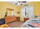 A colorful ' bedroom with hardwood floors, and a window providing plenty of natural light at 901 W Plymouth St, Tampa, FL 33603