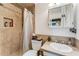 Cozy bathroom featuring tiled shower, mosaic accents, and ample counter space at 1000 Michigan Blvd, Dunedin, FL 34698