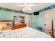 Bedroom featuring decorative wallpaper border, window with blinds, dresser, and closet at 1000 Michigan Blvd, Dunedin, FL 34698