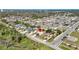 Panoramic aerial view of a residential neighborhood featuring various one-story homes, manicured lawns, and mature trees at 1112 21St E St, Palmetto, FL 34221