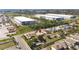 Highlighted property from aerial perspective with neighboring residential homes and industrial structures at 1112 21St E St, Palmetto, FL 34221